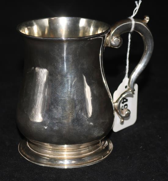 A George II silver mug, of baluster form with C-scroll handle, London 1742, maker Henry Brind